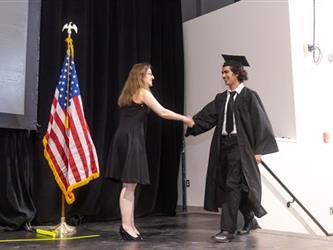 Student shaking hands