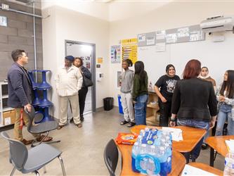 Futures principal is engaging with parents and students in a class