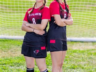 Two teammates posing together