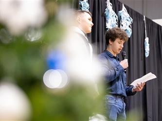 Student speaking into mic