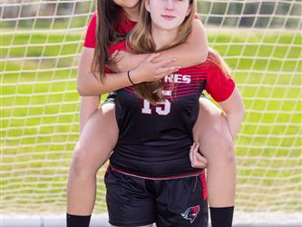 Two teammates posing together