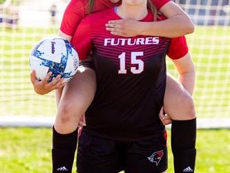 Two players with one on piggyback