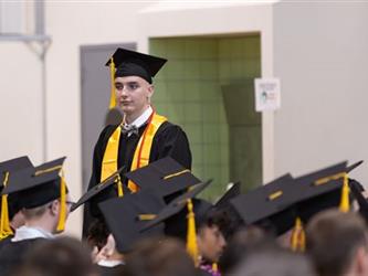 Students standing in audience for recognition