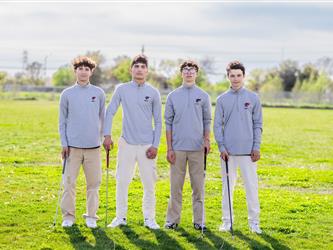 Four golf team players