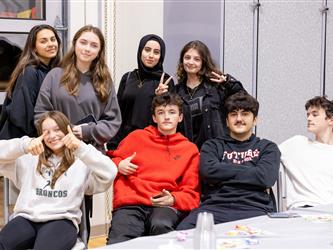 Group of students watching performance
