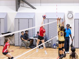 Futures Girls Volleyball team hitting ball