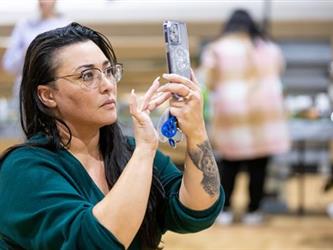 Woman taking photo with cell phone