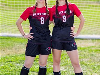 Two teammates posing together