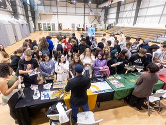 Students in gym with college recruiters
