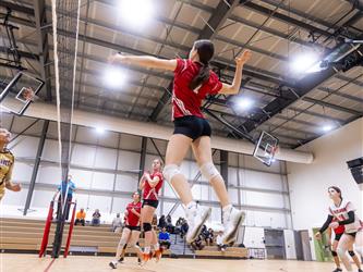 Futures Girls Volleyball team serving