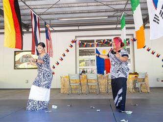 2 students dancing in cultural attire