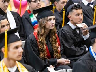 Grads sitting