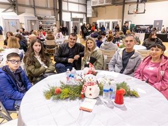 Family at table listening to performance