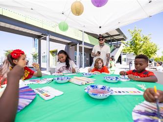 students painting fan 