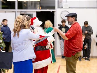 student getting prize from santa 