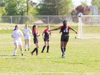 Soccer players in field