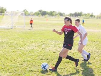Soccer players in field