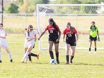 Soccer players in field