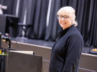Concert conductor smiling at camera