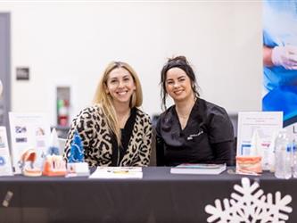 Two volunteers giving out information