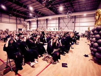 Graduates flipping hats
