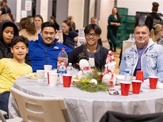Family at table listening to performance