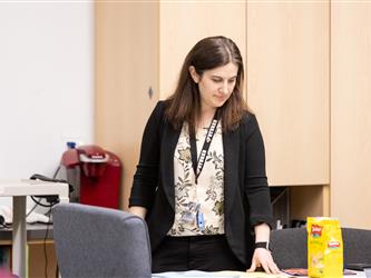 Vice Principal Crystal is seen looking down at the desk