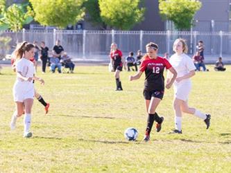 Soccer players in field
