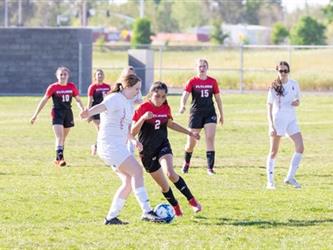 Soccer players in field