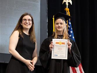 Student receiving award