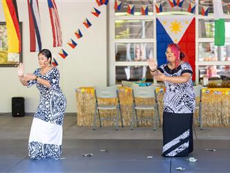 2 students dancing in cultural attire