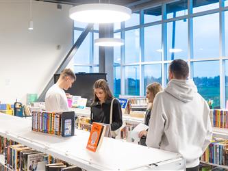 group shot of students in library 