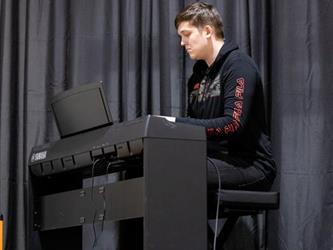 Student playing piano