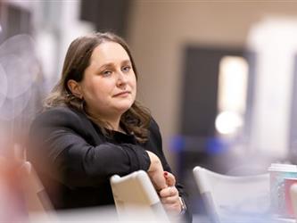 Woman sitting at table listening
