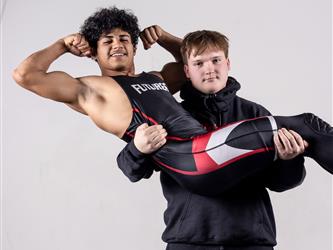 Two teammates posing together