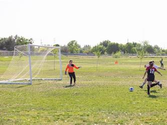 Soccer players in field
