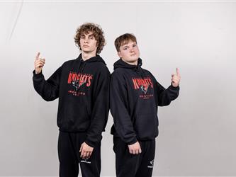 Two wrestling teammates posing