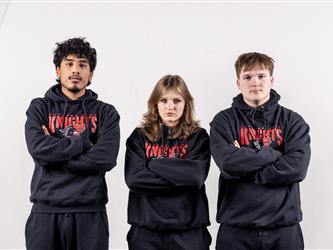 3 wrestling teammates posing