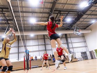 Futures Girls Volleyball team spiking