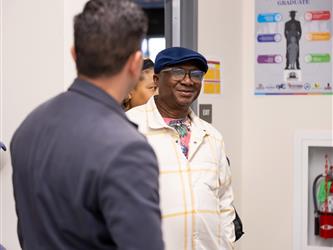 A parent is walking into a classroom