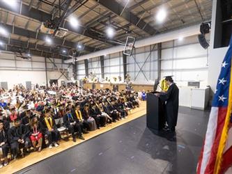Student speaking to graduates