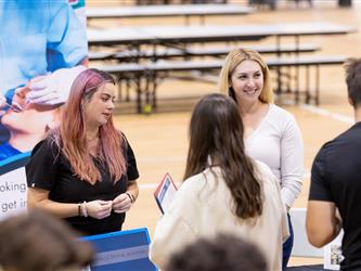 Students speaking with recruiters