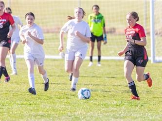 Soccer players in field