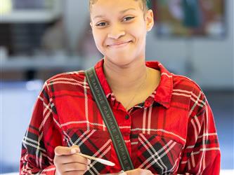 student participating in the painting 