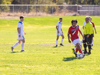 Student dribbling the ball