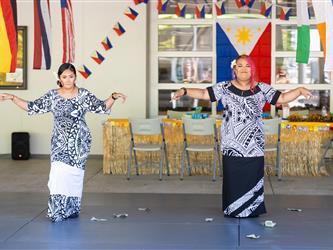 2 students dancing in cultural attire