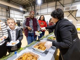 Person helping to serve families