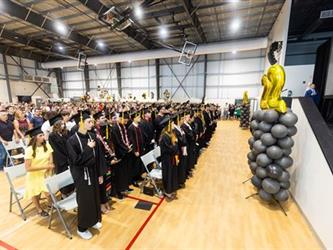 Gym full of parents and grads