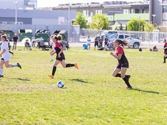 Soccer players in field