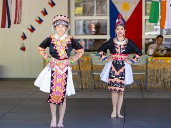 2 students dancing in cultural attire